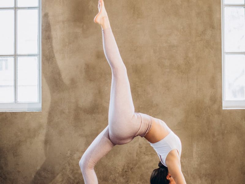 Close up of yoga practitioner focusing on alignment and posture.
