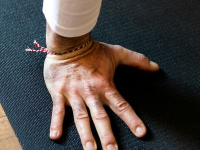 Focus on hand placement during a grounding yoga exercise.